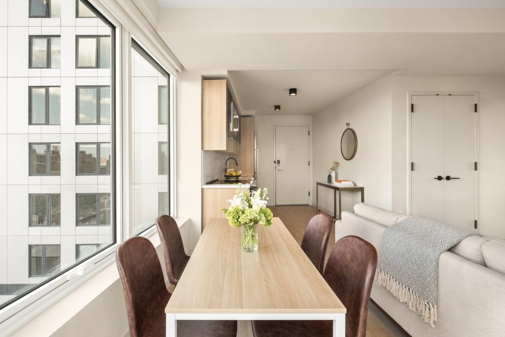 Dining area & living room in one of Maven's luxury apartments in The Bronx