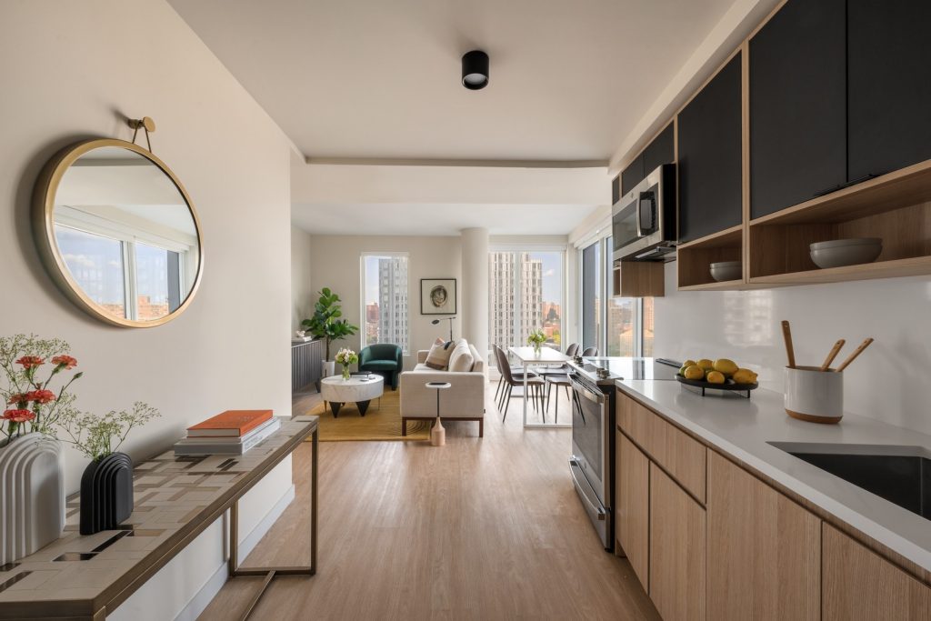 Kitchen, dining area, & living room in one of Maven's luxury apartments in The Bronx