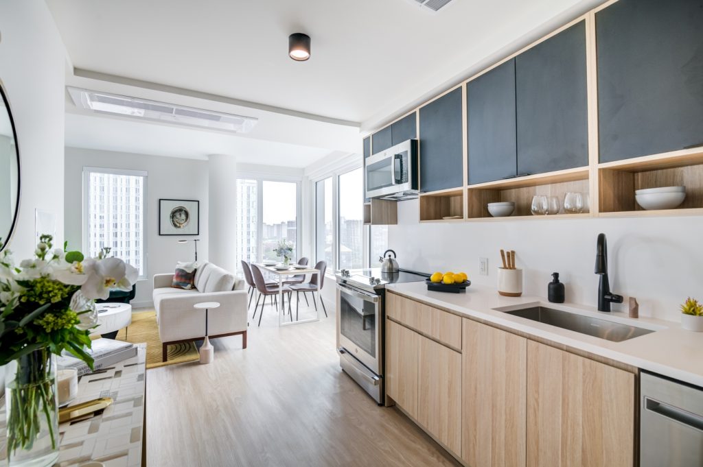 Kitchen, dining area, & living room in one of Maven's luxury apartments in The Bronx